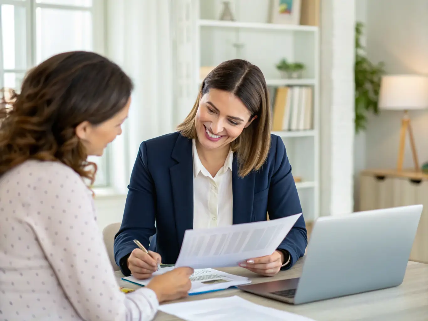 A professional financial advisor reviewing estate and retirement plans with a client in an office setting, representing Wealth Management.